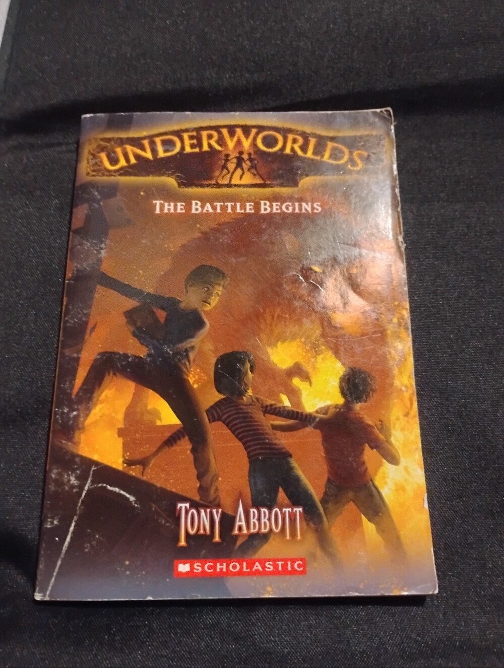 Scholastic Underworlds paperback — orange and black cover art